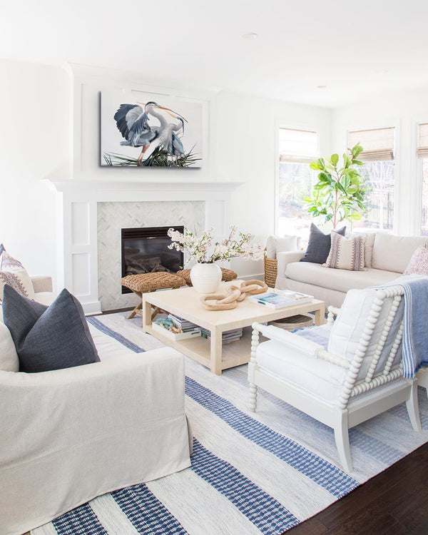 A canvas print featuring two great blue herons in an elegant pose, building a nest with detailed feathering and a contemporary background by wildlife artist James Corwin oil painting. Hanging in living room wall art home decor.