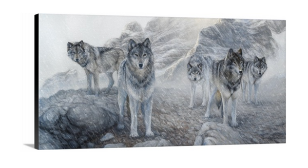 A limited edition giclee canvas print featuring a group of wolves in a snowy mountain landscape. The print is gallery-wrapped by wildlife artist James Corwin.