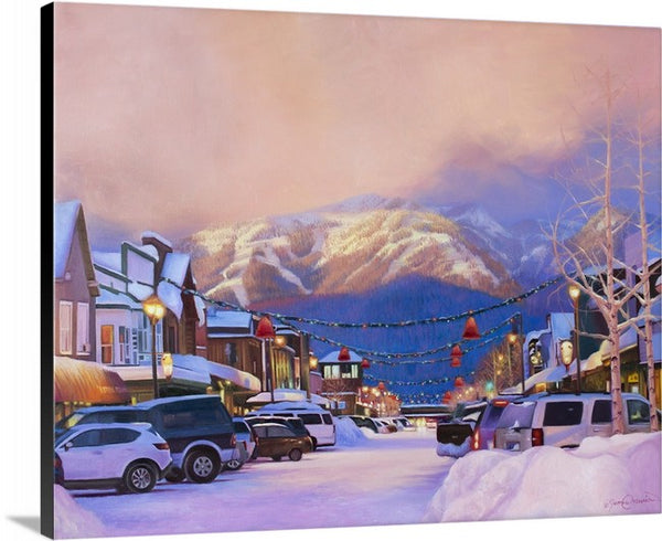 A canvas print depicting big mountain whitefish mountain resort in a snowy downtown scene at sunset under Christmas lights. Whitefish Montana painting by wildlife artist James Corwin.