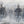 A canvas print depicting a herd of Yellowstone bison in a misty snowy landscape. Oil painting artwork 'Giants in the Mist IV' by wildlife artist James Corwin.