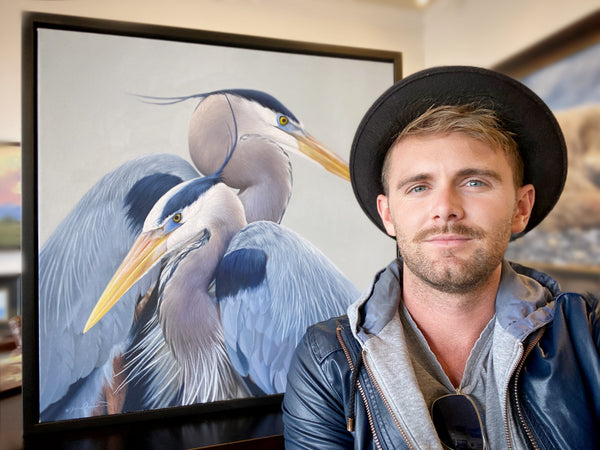 A canvas print of two great blue herons with a gray, blue, and yellow color palette. An oil painting by wildlife artist James Corwin.