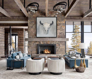 A canvas giclee print of a bison skull, with a misty, soft-focus background of ghostly Yellowstone buffalo, part of a limited edition art oil painting by Montana widllife artist James Corwin. Hanging in home wall art decor