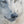 A canvas print featuring a wolf in snow, with a blurred background by wildlife artist James Corwin.