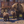 A canvas print featuring the Sperry Chalet in Glacier National Park with a family of grizzly bears in the foreground. Oil painting by Montana wildlife artist James Corwin.