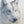 A canvas print featuring a wolf in snow, with a blurred background by wildlife artist James Corwin.