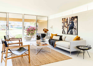 An oil painting of ravens in Joshua Tree National Park. Contemporary limited edition giclee print by wildlife artist James Corwin. Hanging in Palm Springs living room wall art home decor.