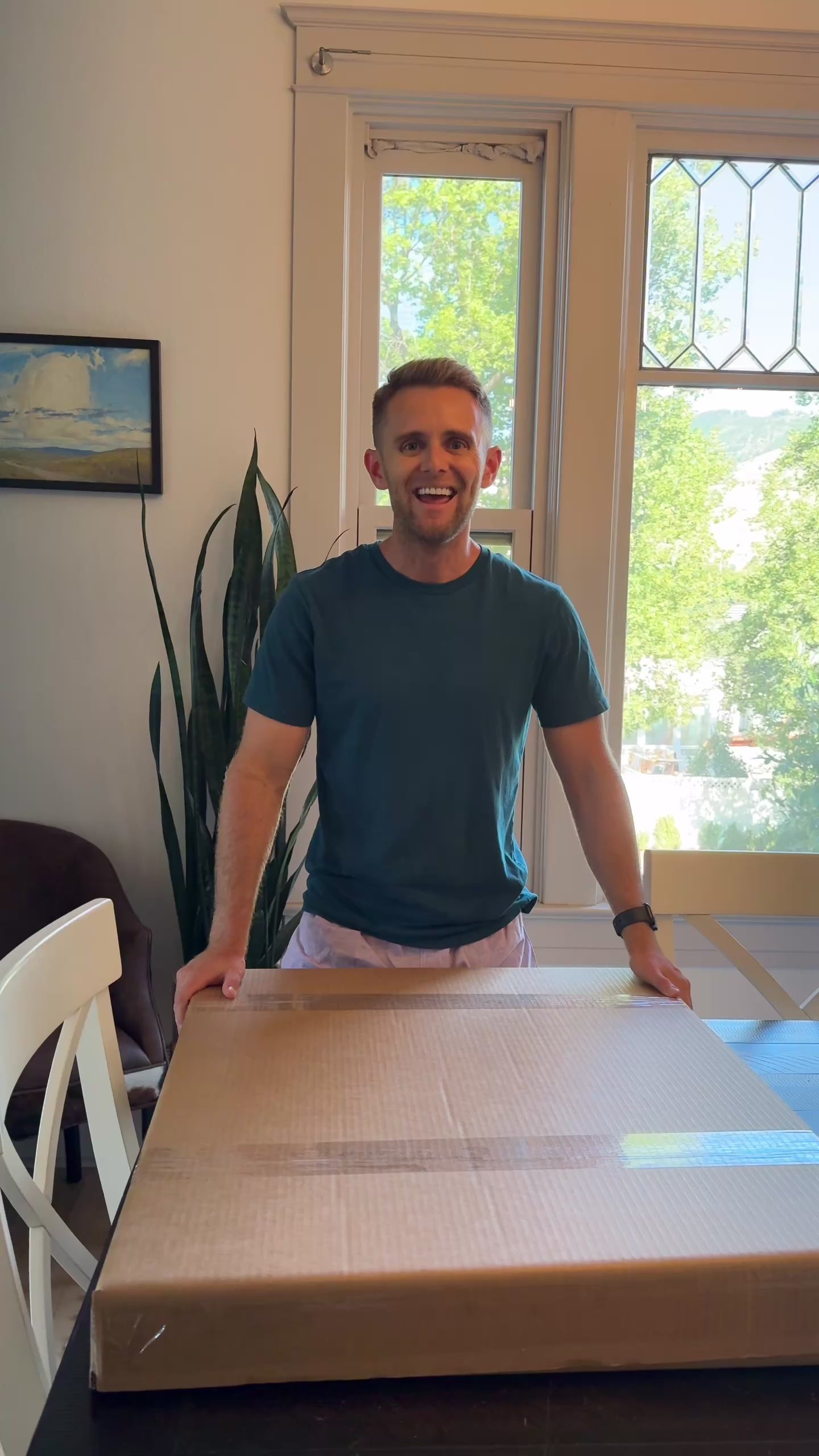 Bumblebee Bear by wildlife artist James Corwin. A Painting of a black bear with a colorful textured background. Video of artist opening print from package and hanging animal art on wall.