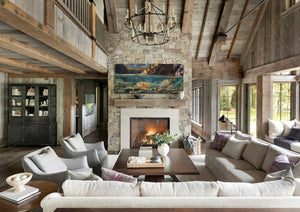 A canvas print titled 'A Secret Spot' by wiildlife artist James Corwin, depicting a vibrant river scene with multiple cutthroat trout swimming in the water, surrounded by yellowing tamaracks and a clear blue sky. Wall art home decor, hanging in living room.