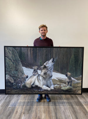 A canvas print featuring a mother wolf and her pups howling in a forest setting, an oil painting by wildlife artist James Corwin, based in Montana western art.