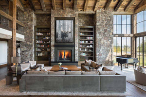 A canvas print of a bull moose in a winter aspen forest setting. Montana Oil painting by wildlife artist James Corwin. Hanging in home wall art decor.