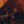 An oil painting as a limited edition canvas print depicting a bull moose in a fiery wildfire setting by Montana wildlife artist James Corwin.