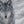 A limited edition giclee canvas print featuring a group of wolves in a snowy mountain landscape. The print is gallery-wrapped by wildlife artist James Corwin.