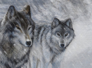 A limited edition giclee canvas print featuring a group of wolves in a snowy mountain landscape. The print is gallery-wrapped by wildlife artist James Corwin.