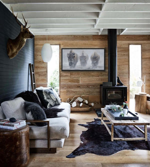 A giclee canvas print of three yellowstone bison in a misty winter setting from an oil painting by James Corwin wildlife artist. Hanging in home wall decor.