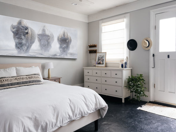 A giclee canvas print of three yellowstone bison in a misty winter setting from an oil painting by James Corwin wildlife artist. Hanging in bedroom wall decor.
