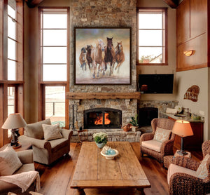A canvas print featuring a group of horses running in a dust cloud, capturing a sense of motion and freedom. Oil painting by wildlife artist James Corwin. Hanging in living room wall art home decor.